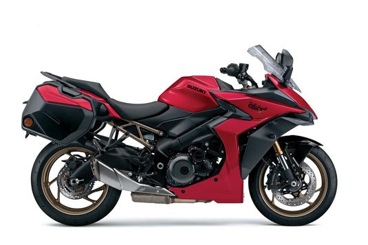 A Candy Daring Red 2025 Suzuki GSX-S 1000 TRQ motorcycle with side panniers and a windscreen, photographed from a side profile against a plain white background.