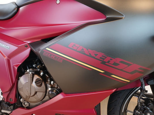 Close-up of a red and black 2025 Suzuki GSX 250 FR motorcycle with 'Gixxer' branding.